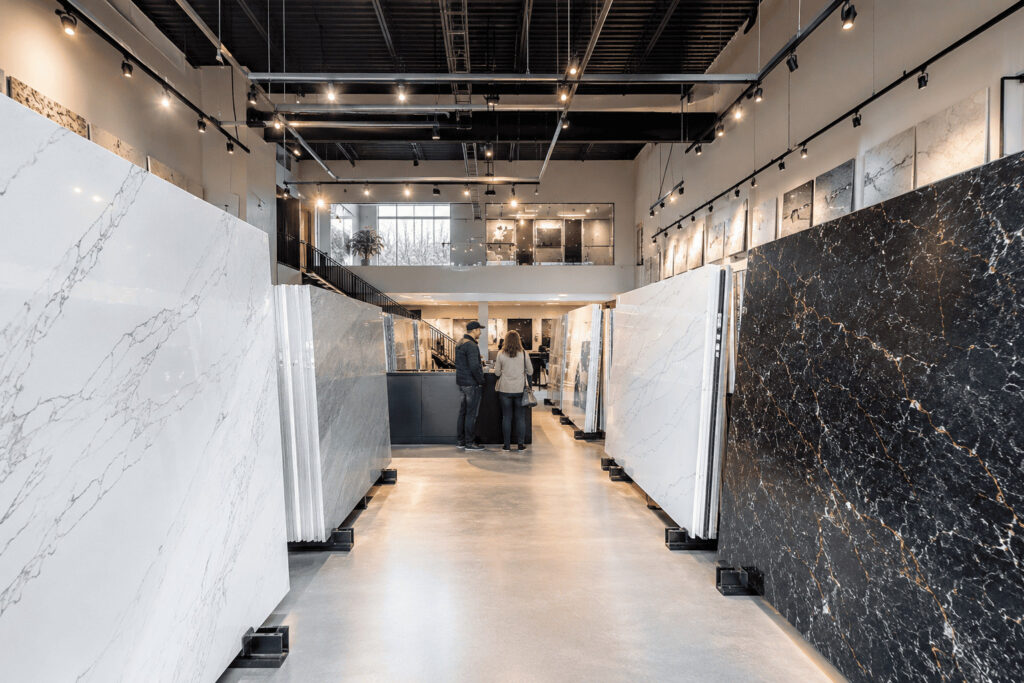 Premium quartz countertops Kitchener showroom displaying full-size quartz slabs in various colors and patterns.