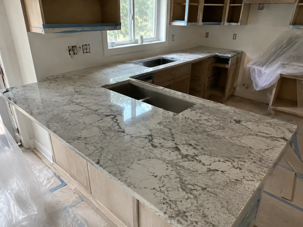 Local countertop installers completing the countertop installation process in a kitchen