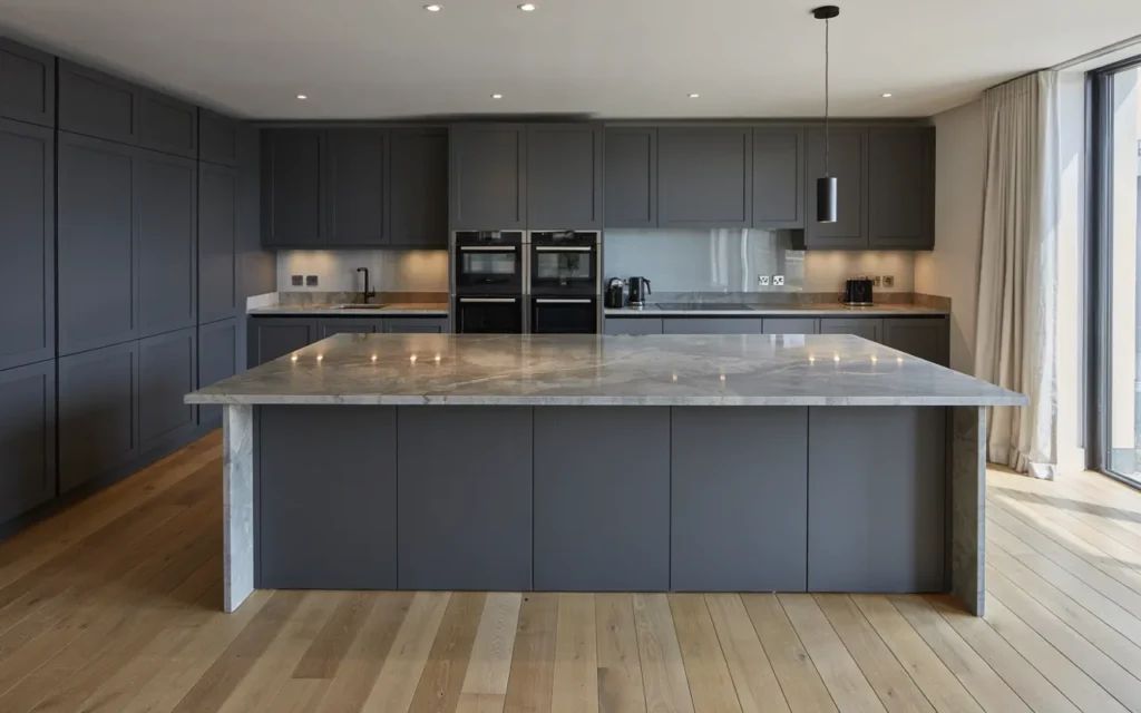 Modern gray granite countertops with dark charcoal kitchen cabinets